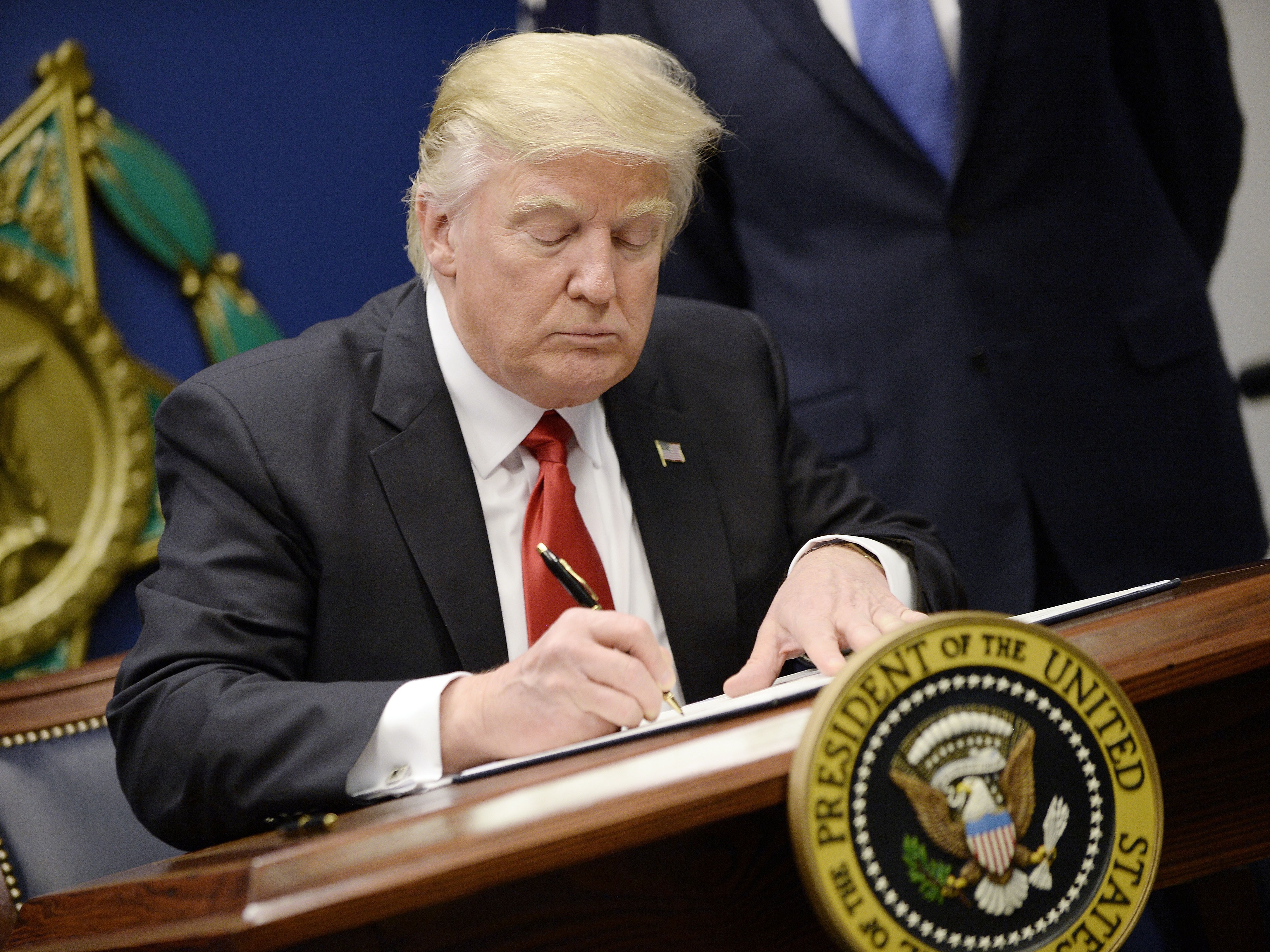 President Donald Trump signed an executive order on Friday that puts a freeze on immigration from seven countries: Syria, Iran, Libya, Somalia, Yemen, Iraq and Sudan. (Getty Images)