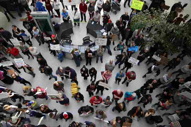 By 1 p.m. Sunday, roughly 300 people had gathered at Sacramento International Airport in northern California to protest Trump's executive order on immigration.