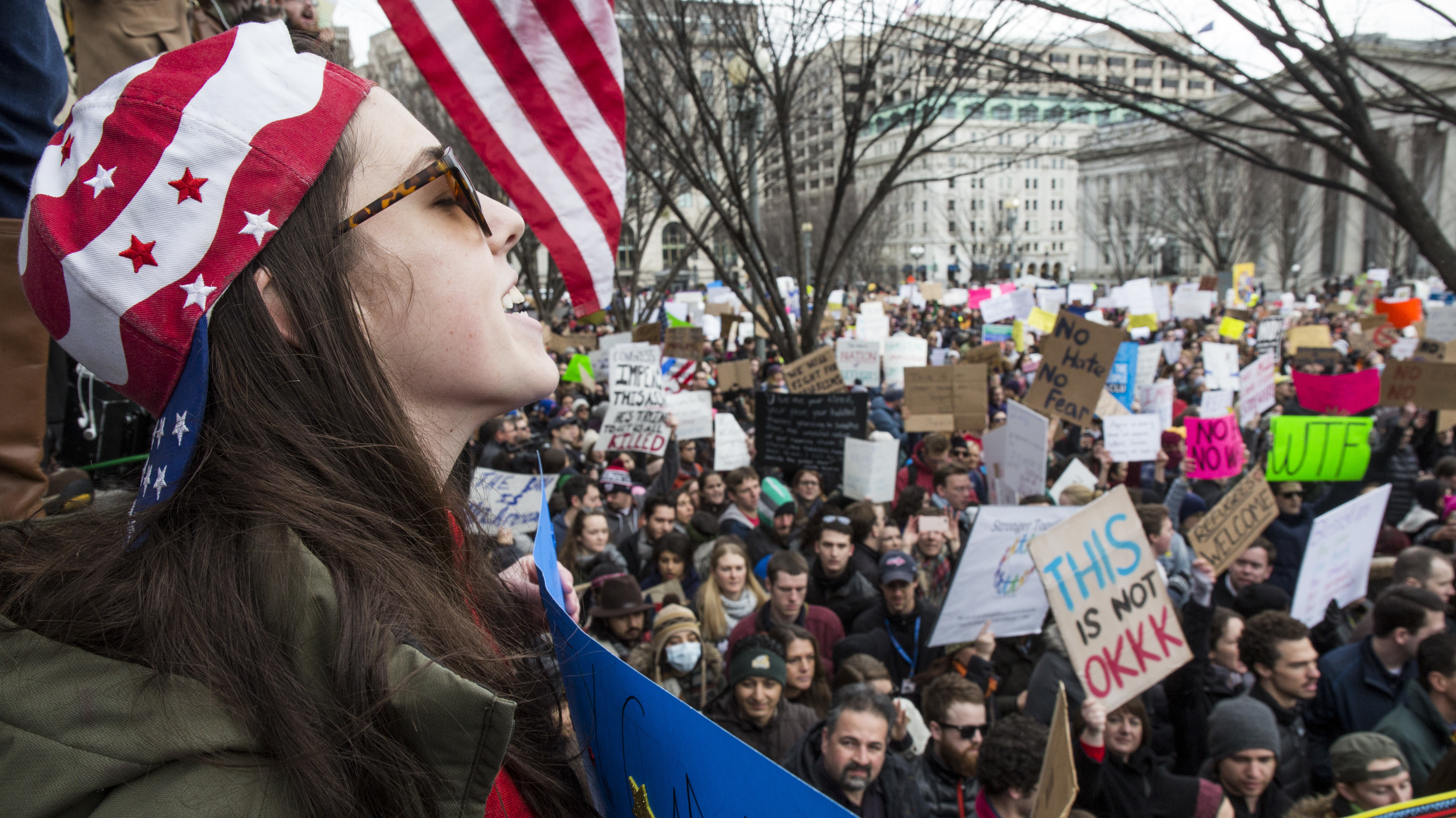 Demonstrators gather near the White House to protest President Trump