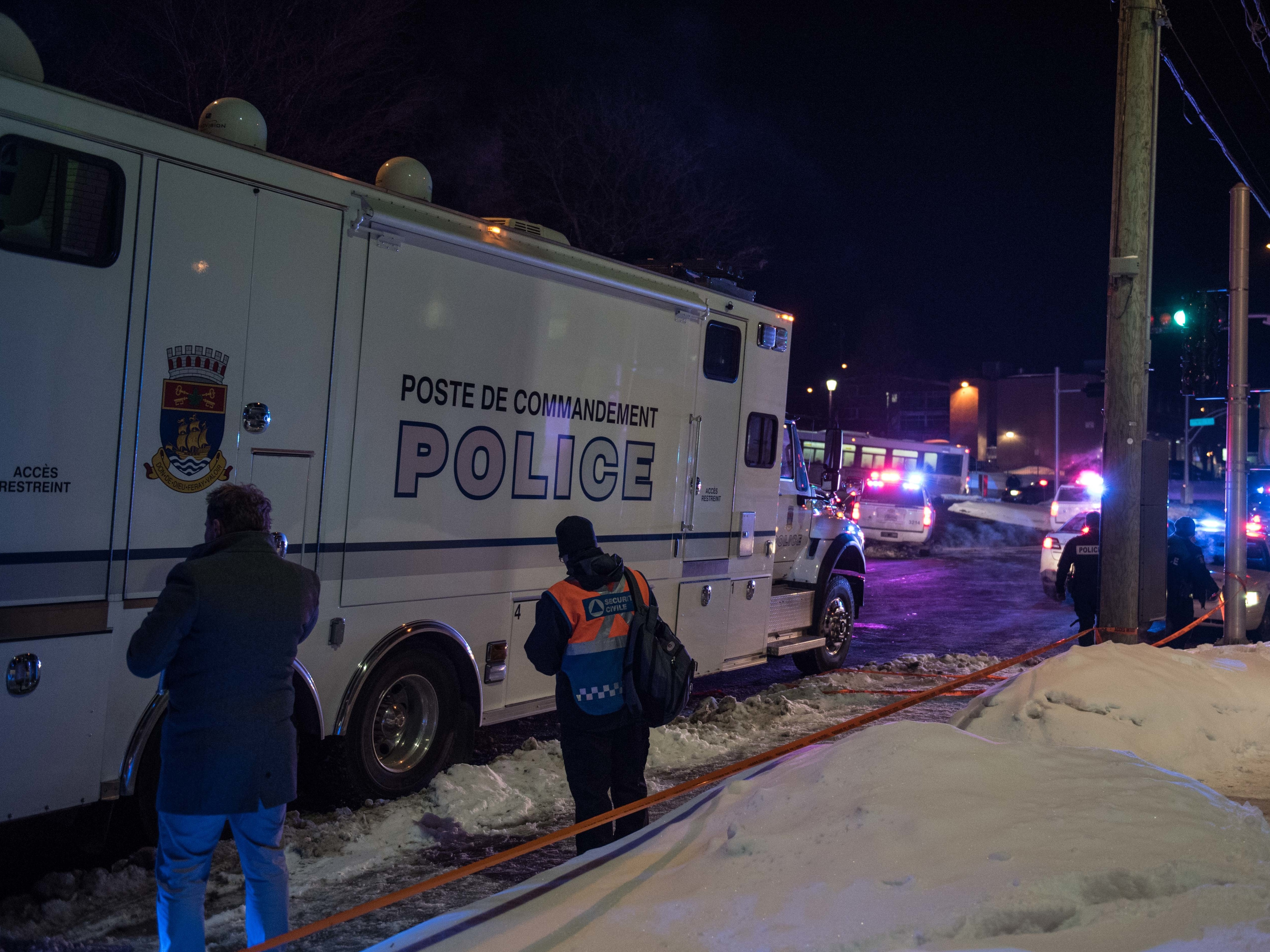 Police officers respond to a shooting in a mosque at the Quebec City Islamic Cultural Centre in Quebec City on Sunday. (AFP/Getty Images)