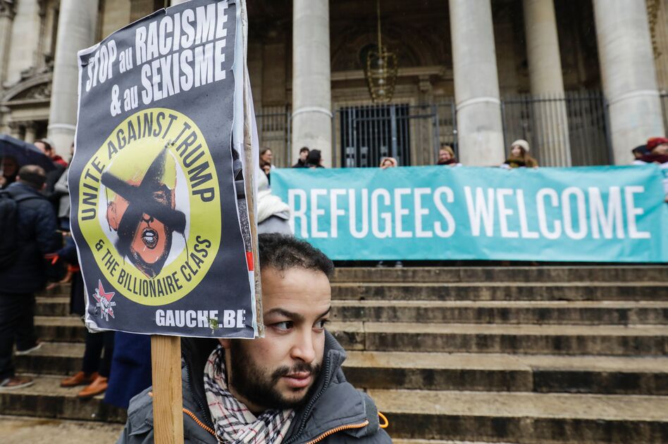 People protest against President Trump's executive immigration ban on Monday in Brussels, Belgium. (Thierry Roge/AFP/Getty Images)
