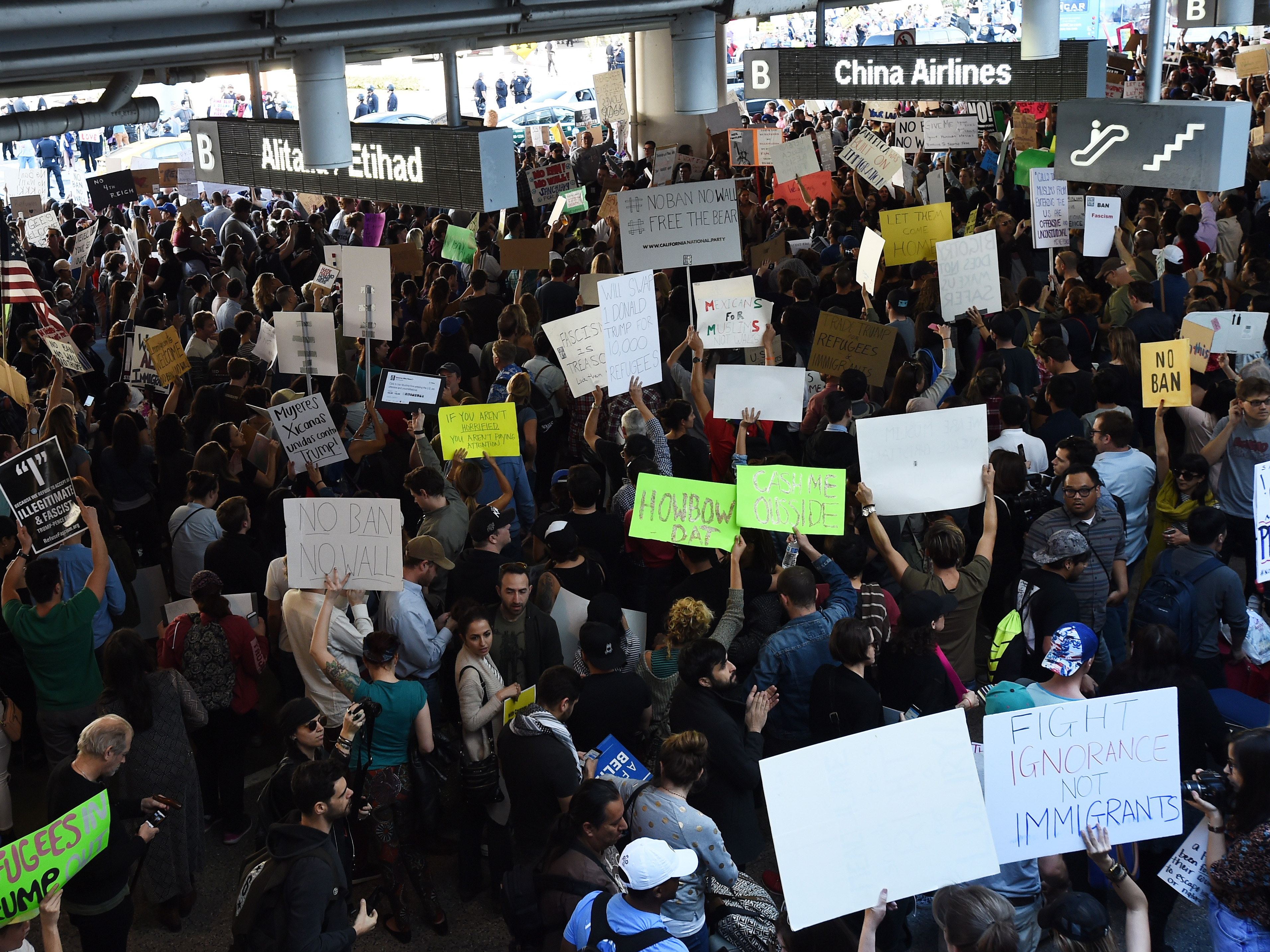 Protesters at Los Angeles International Airport rally Sunday against President Trump's executive order halting entry of refugees and others into the U.S. (Getty Images)