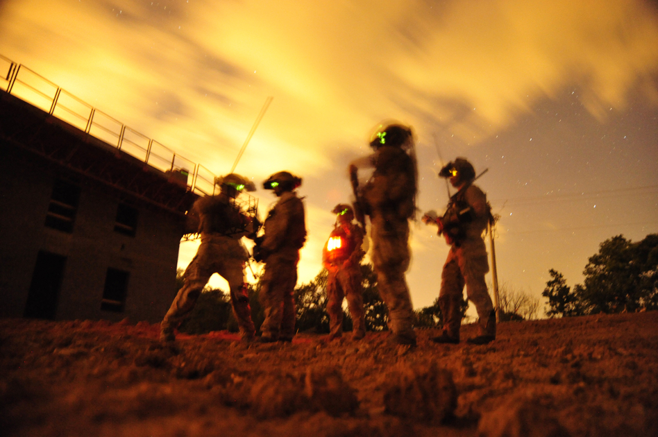Navy SEALs participate in special operations urban combat training in 2012. The training exercise familiarizes special operators with urban environments and tactical maneuvering during night and day operations. (Mass Communication Spc. 2nd Class Meranda Keller/U.S. Navy)