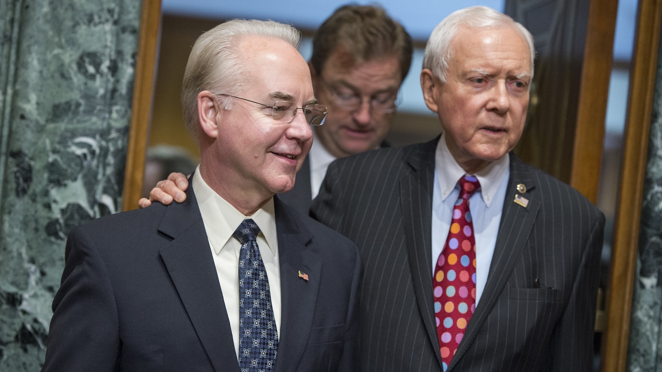 Rep. Tom Price, R-Ga., center, nominee for Health and Human Services secretary, is seen with Chairman Orrin Hatch, R-Utah, before his Senate Finance Committee confirmation hearing on Jan. 24. (CQ-Roll Call/Getty Images)