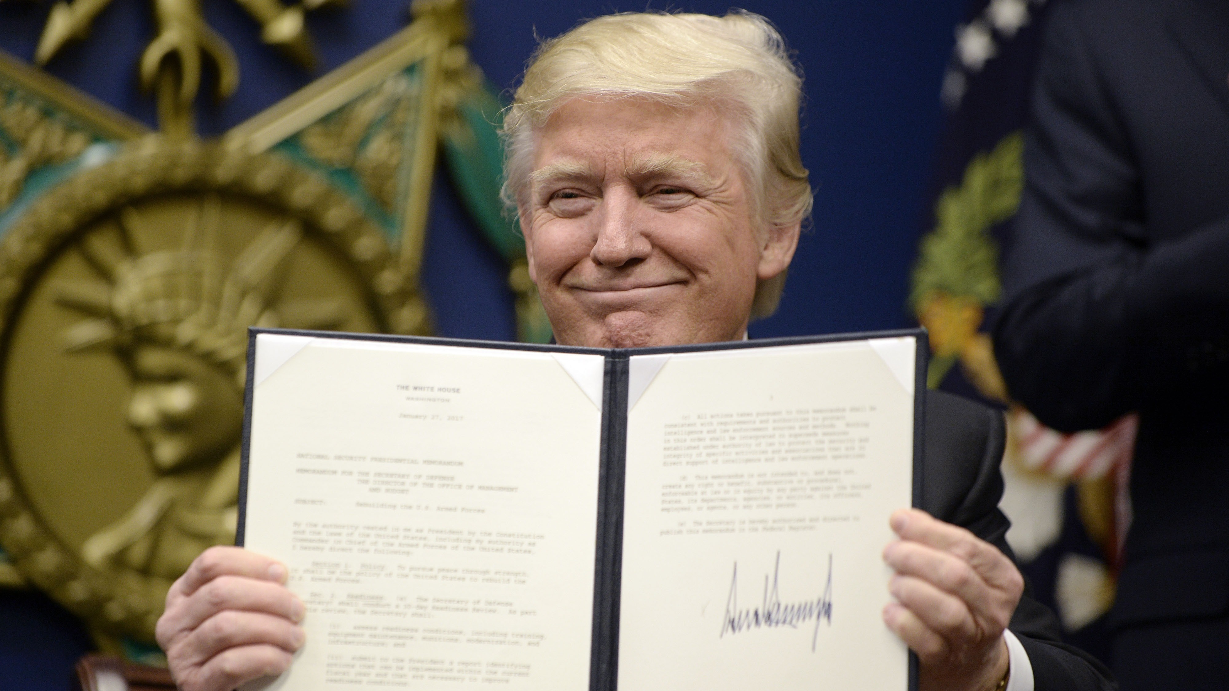 President Trump signs two executive orders at the Department of Defenseon  Friday — calling for the &quot;great rebuilding&quot; of the military and for &quot;extreme vetting&quot; of visa seekers from seven countries. (Getty Images)