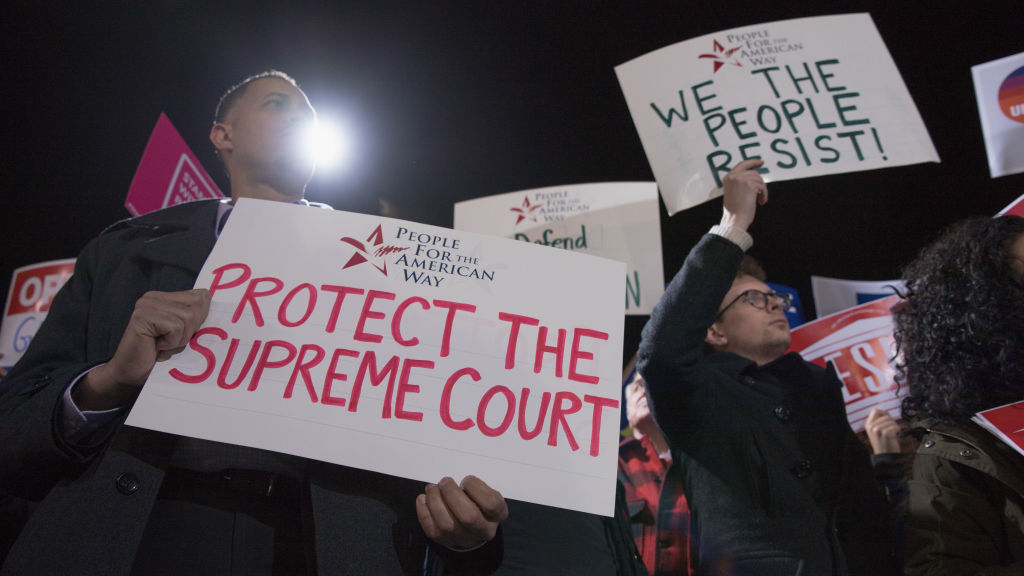 Diallo Brooks, director of outreach and public engagement at People For the American Way, protests President Trump's Supreme Court pick at the steps of the court. (Getty Images)