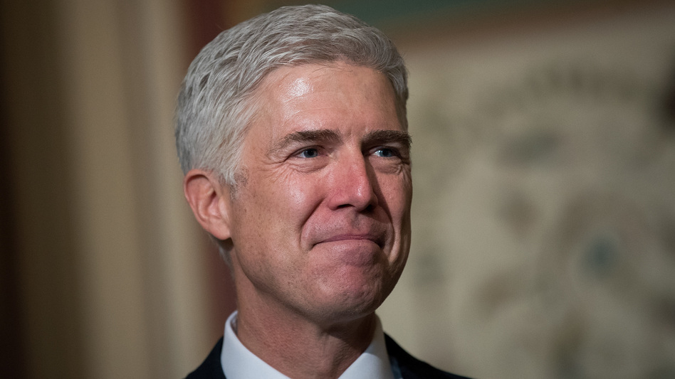 Supreme Court nominee Neil Gorsuch looks on as Senate Judiciary Committee Chairman Chuck Grassley speaks to reporters before their meeting Wednesday on Capitol Hill. (Drew Angerer/Getty Images)