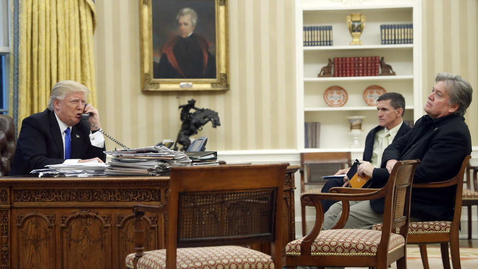 President Trump speaks on the phone with Australian Prime Minister Malcolm Turnbull, with national security adviser Michael Flynn (center) and chief strategist Steve Bannon in the Oval Office of the White House on Saturday. (Alex Brandon/AP)