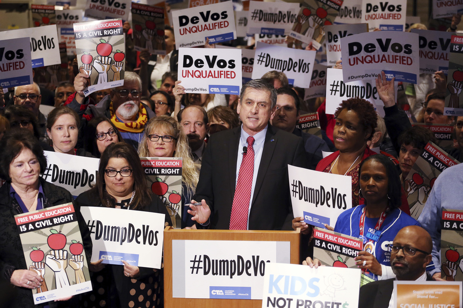 California Teachers Association President Eric Heins speaks as California educators voice their opposition to President Trump's nomination of Besty DeVos for secretary of education, at a meeting in Los Angeles on Jan. 28. (Reed Saxon/AP)