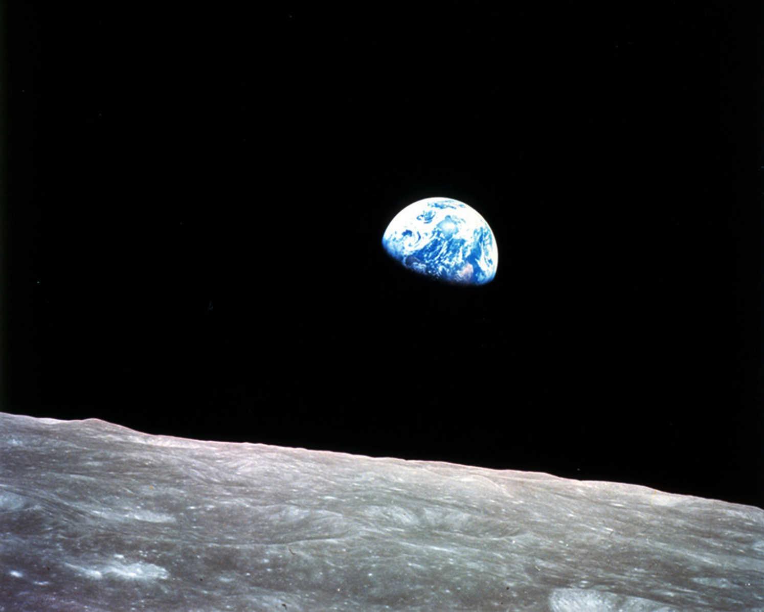 This photo of Earthrise over the lunar horizon was taken by the Apollo 8 crew in December 1968, showing Earth for the first time as it appears from deep space.