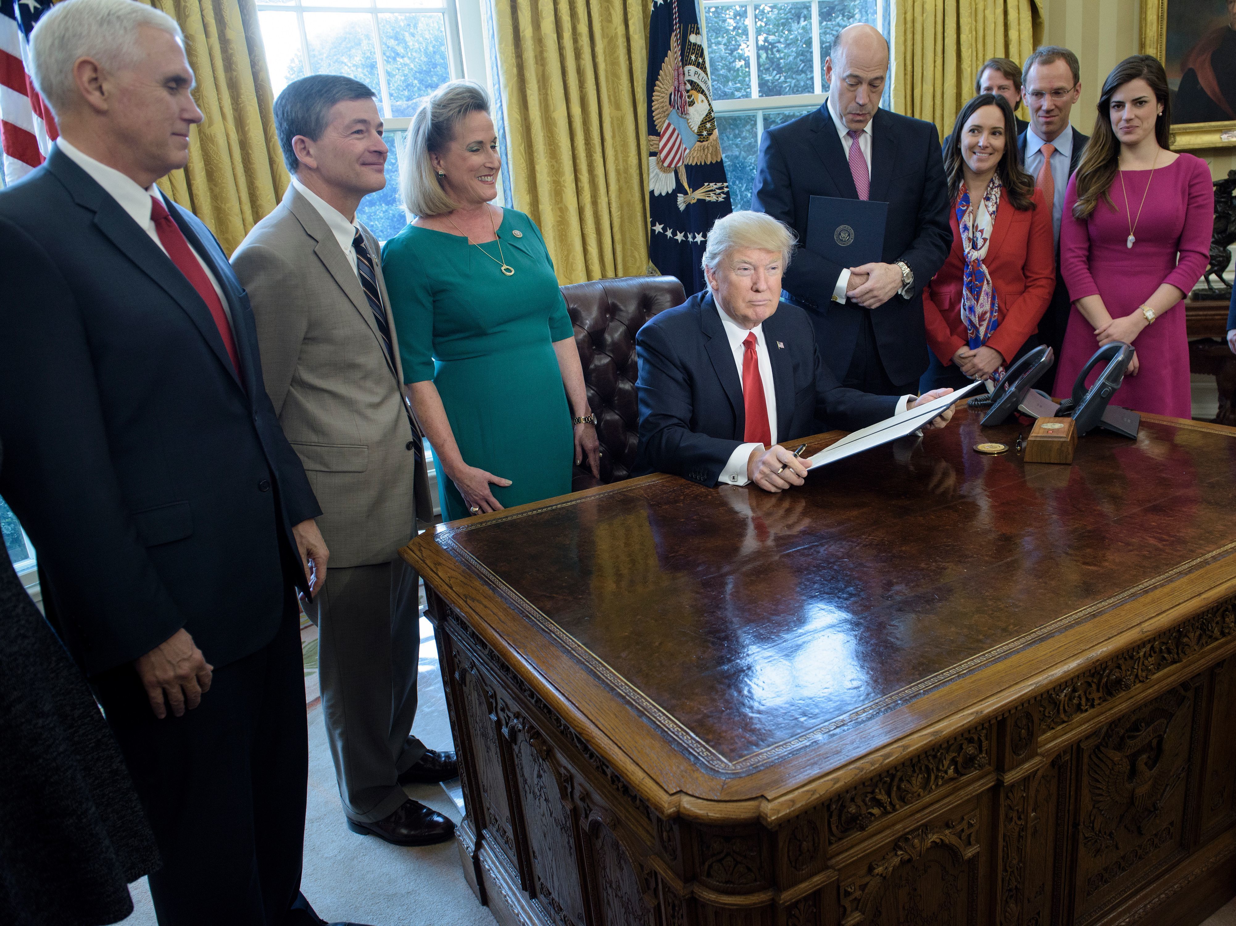 Trump Takes Aim At Dodd-Frank, Investor Protections Rule In Executive Action