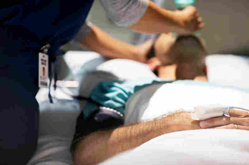 A photo of a patient receiving care in the hospital.