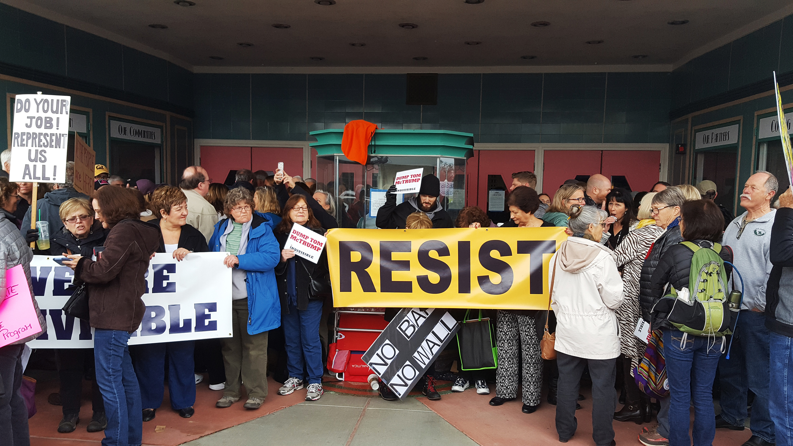 Protesters wait to get into a town hall meeting held by Rep. Tom McClintock (R-Calif.) in Roseville, Calif., on Saturday. (KQED)