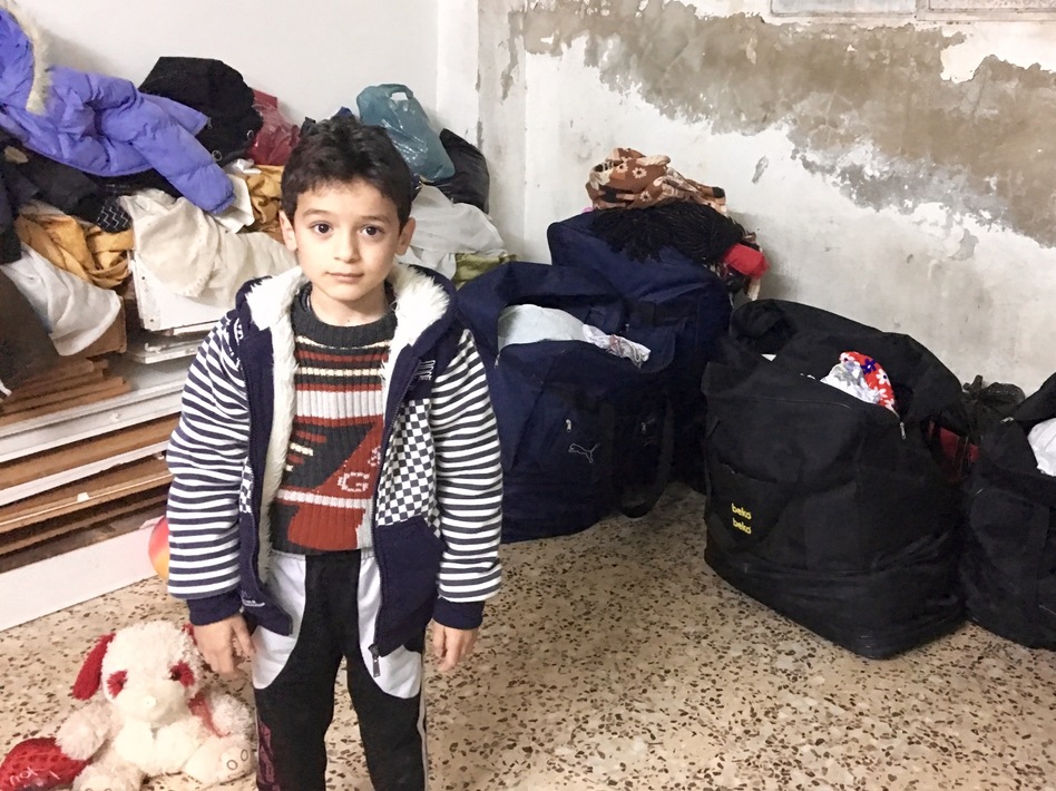 Six-year-old Yazan wants to be a policeman. His parents say he started stuttering after being frightened by the sound of jets in Syria and he still doesn't talk much. (Jane Arraf/NPR)