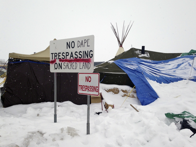 Protesters have stayed near the Dakota Access Pipeline site during the winter. (James MacPherson/AP)
