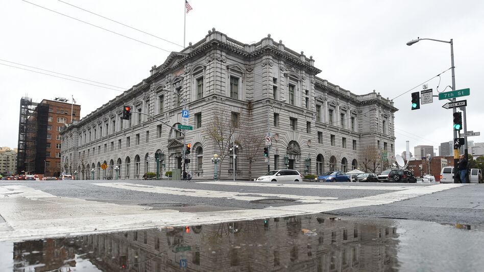 On Tuesday, arguments related to President Trump's temporary travel ban will be presented by phone to a three-judge panel of the 9th U.S. Circuit Court of Appeals and live-streamed at the James R. Browning U.S. Court of Appeals building in San Francisco. (Josh Edelson/AFP/Getty Images)