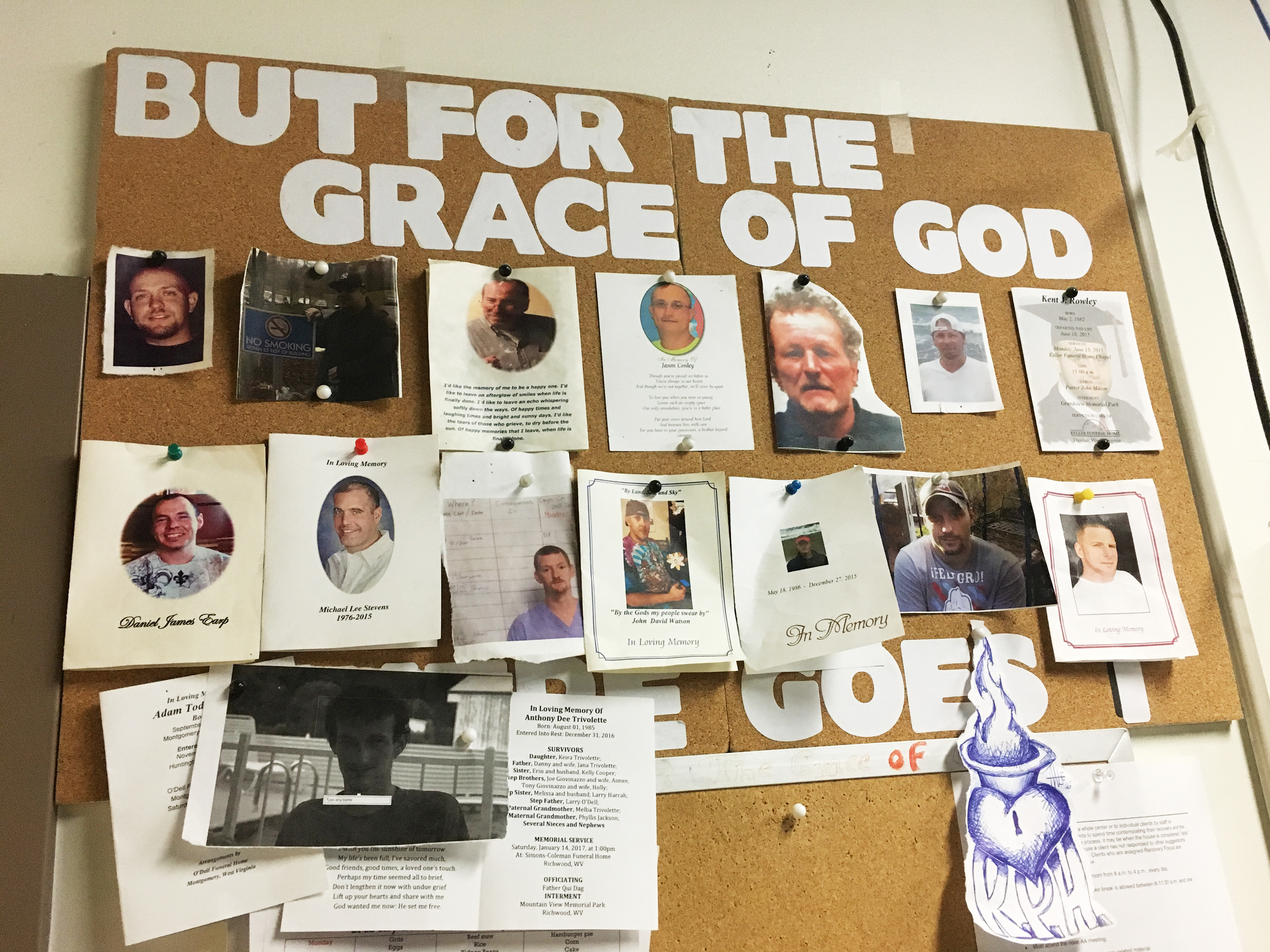 A bulletin board in the detox unit at Recovery Point of Huntington, W.Va., a residential drug and alcohol treatment facility, is covered with photos of former residents who died of their addictions. (NPR)