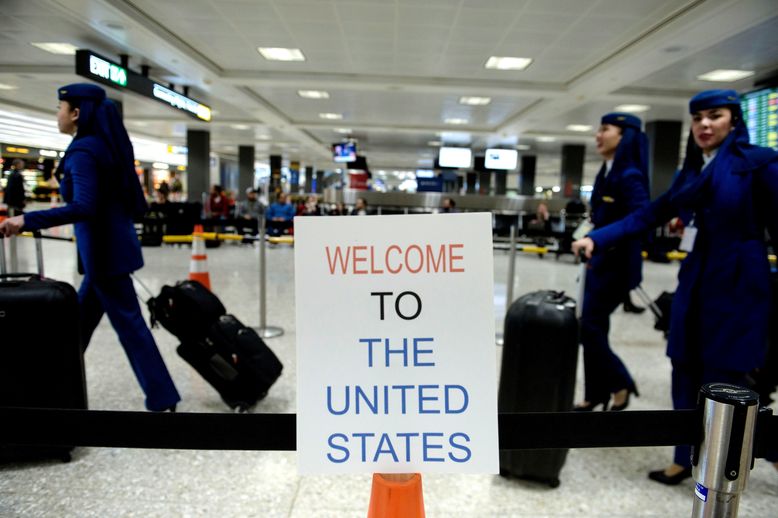 A sign at Washington Dulles International Airport welcomes travelers. A three-judge panel decided not to reinstate President Trump's travel ban barring travelers from seven majority-Muslim nations. (AFP/Getty Images)