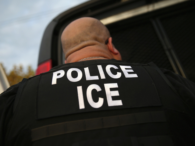 An Immigration and Customs Enforcement agent detains an immigrant in 2015 in Los Angeles. A new round of detentions this week has triggered complaints from immigrant advocates. (John Moore/Getty Images)