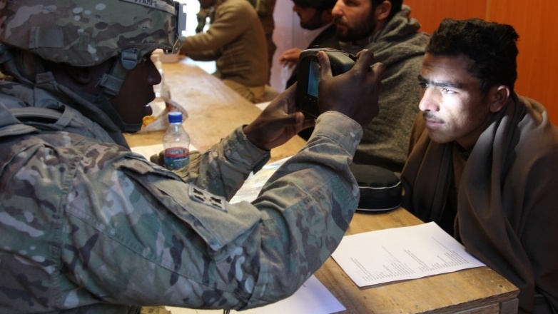 An American soldier scanned the retina of a man in Nangarhar Province, Afghanistan in Dec. 2011. Russia cites the danger of ISIS in Nangarhar as its reason for backing the Taliban, the U.S. says. (U.S. Army)