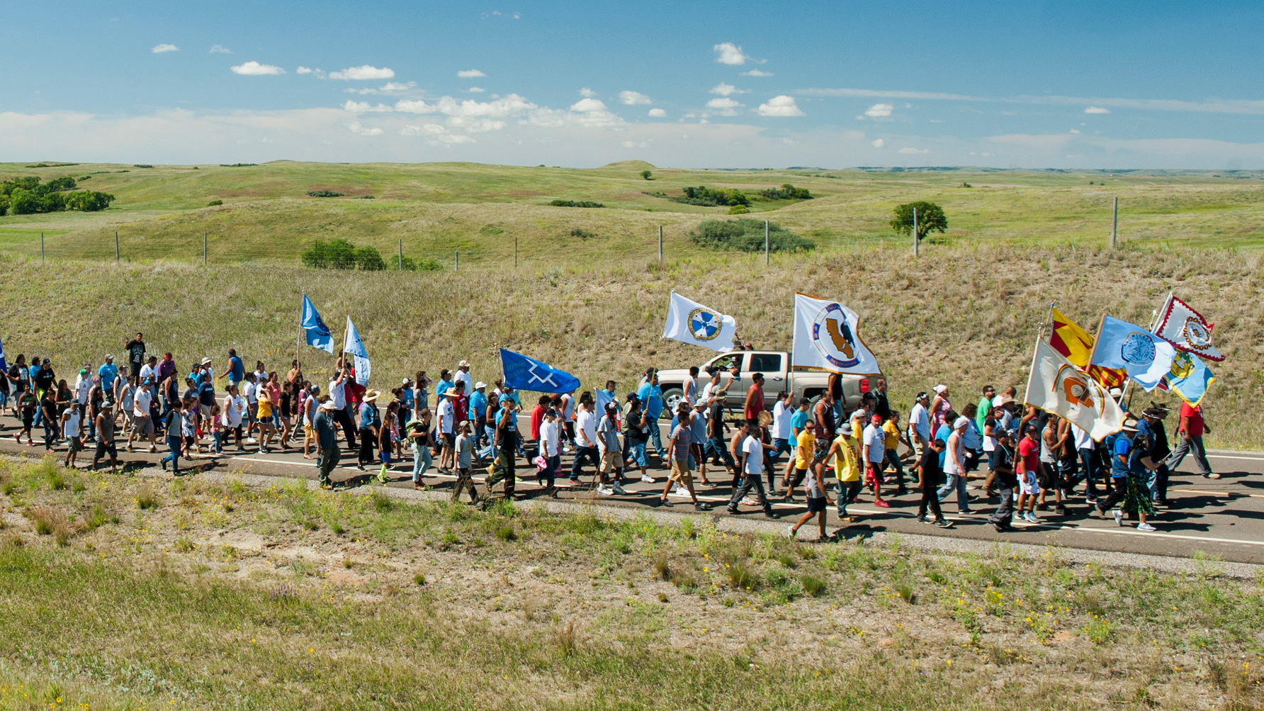 Demonstrators march from an encampment on the banks of the Cannonball River to a nearby construction site for the Dakota Access Pipeline to perform a daily prayer ceremony in September 2016.