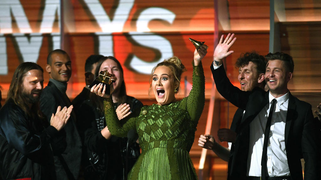 Adele broke her Album Of The Year Grammy in an effort to share it with Beyoncé. (Getty Images)