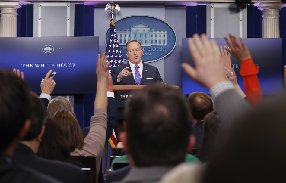 White House Press secretary Sean Spicer takes questions from the media on Tuesday. He said it was President Trump's decision to have national security adviser Michael Flynn resign. (Pablo Martinez Monsivais/AP)