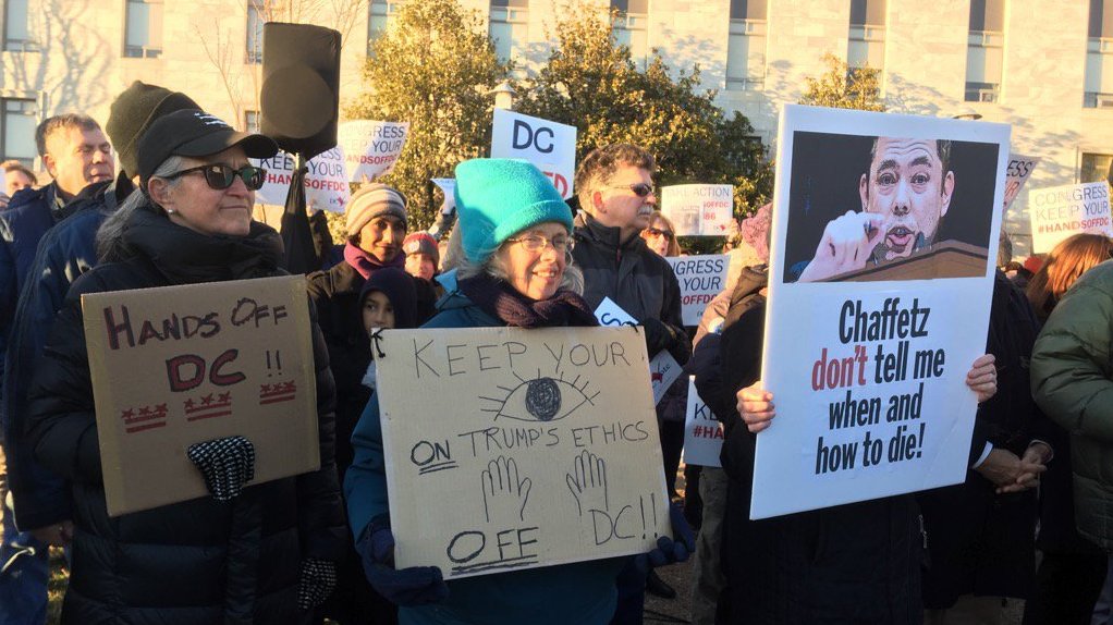 Protesters in favor of Washington, D.C's assisted suicide law gather outside congressional office buildings on Feb. 13. (WAMU)