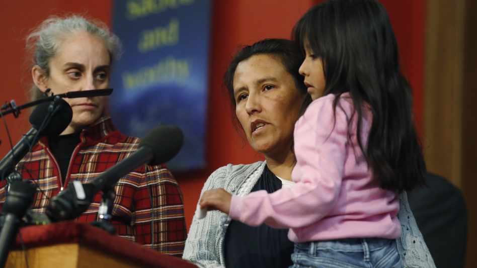Jeanette Vizguerra, a Mexican woman seeking to avoid deportation from the United States, speaks Wednesday as she holds her 6-year-old daughter, Zuri, during a news conference in a Denver church in which Vizguerra and her children have taken refuge. (David Zalubowski/AP)