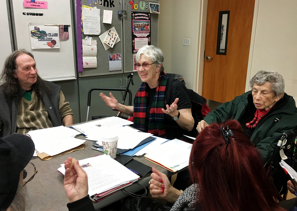 Janet Hoult (center) teaches a poetry workshop in Southern California.