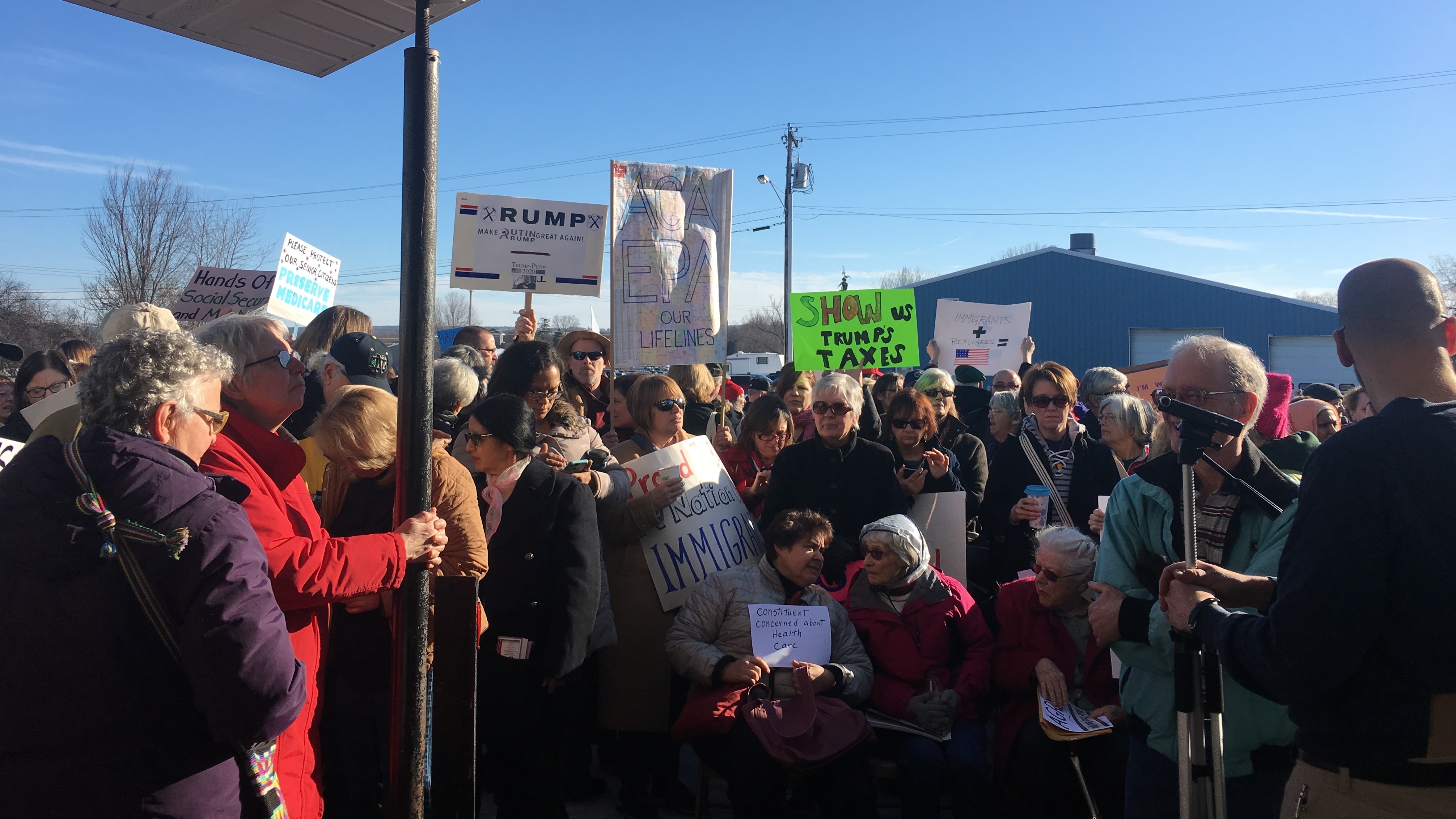 An overflow crowd forced Rep. Tom Reed, R-N.Y., to hold his first town hall in Ashville, N.Y., outside in a parking lot instead of inside the seniors center. (NPR)