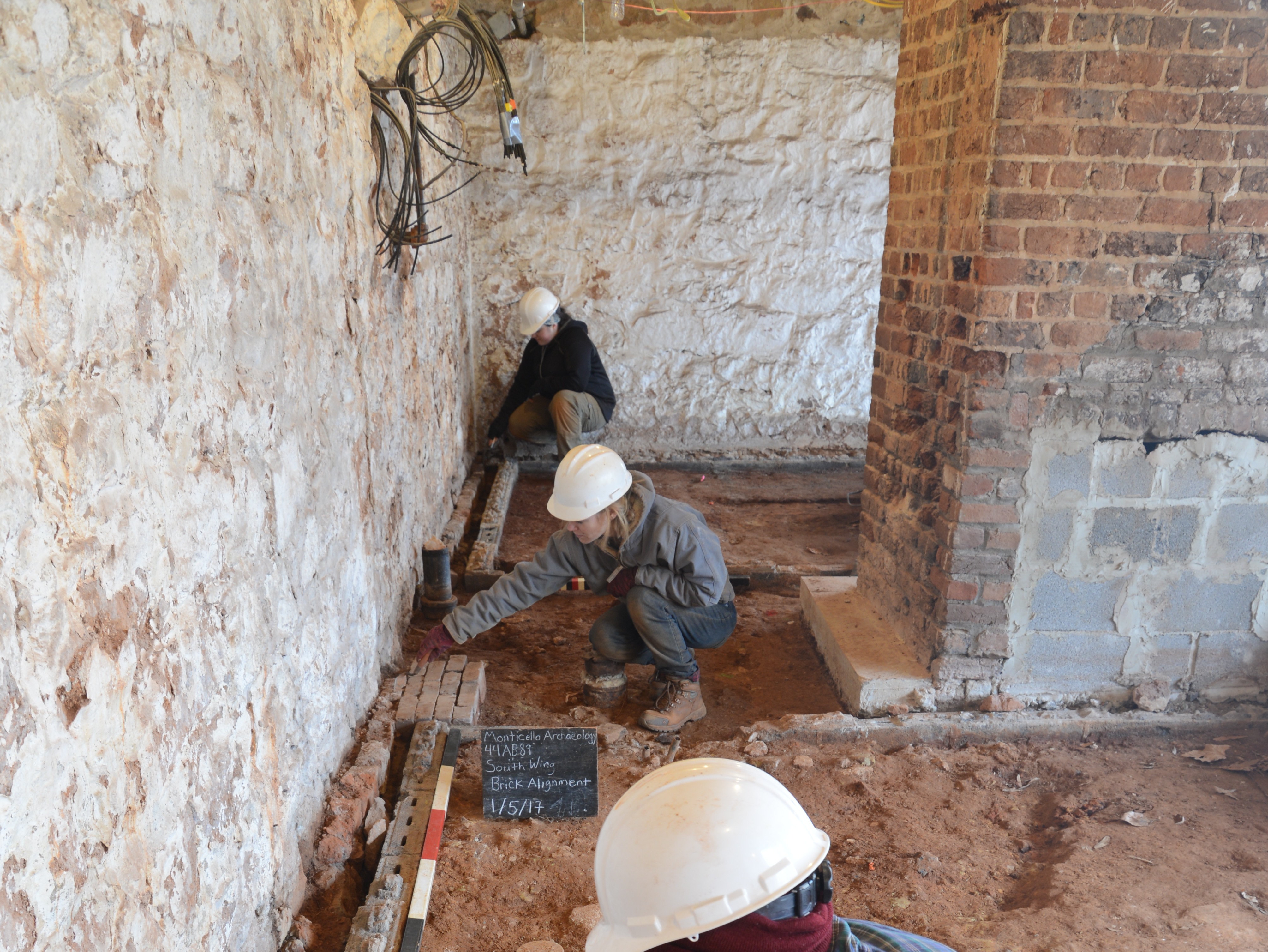 Archaeologists uncover the original brick floor of what is believed to be Sally Hemings' living quarters at Monticello.
©Thomas Jefferson Foundation at Monticello