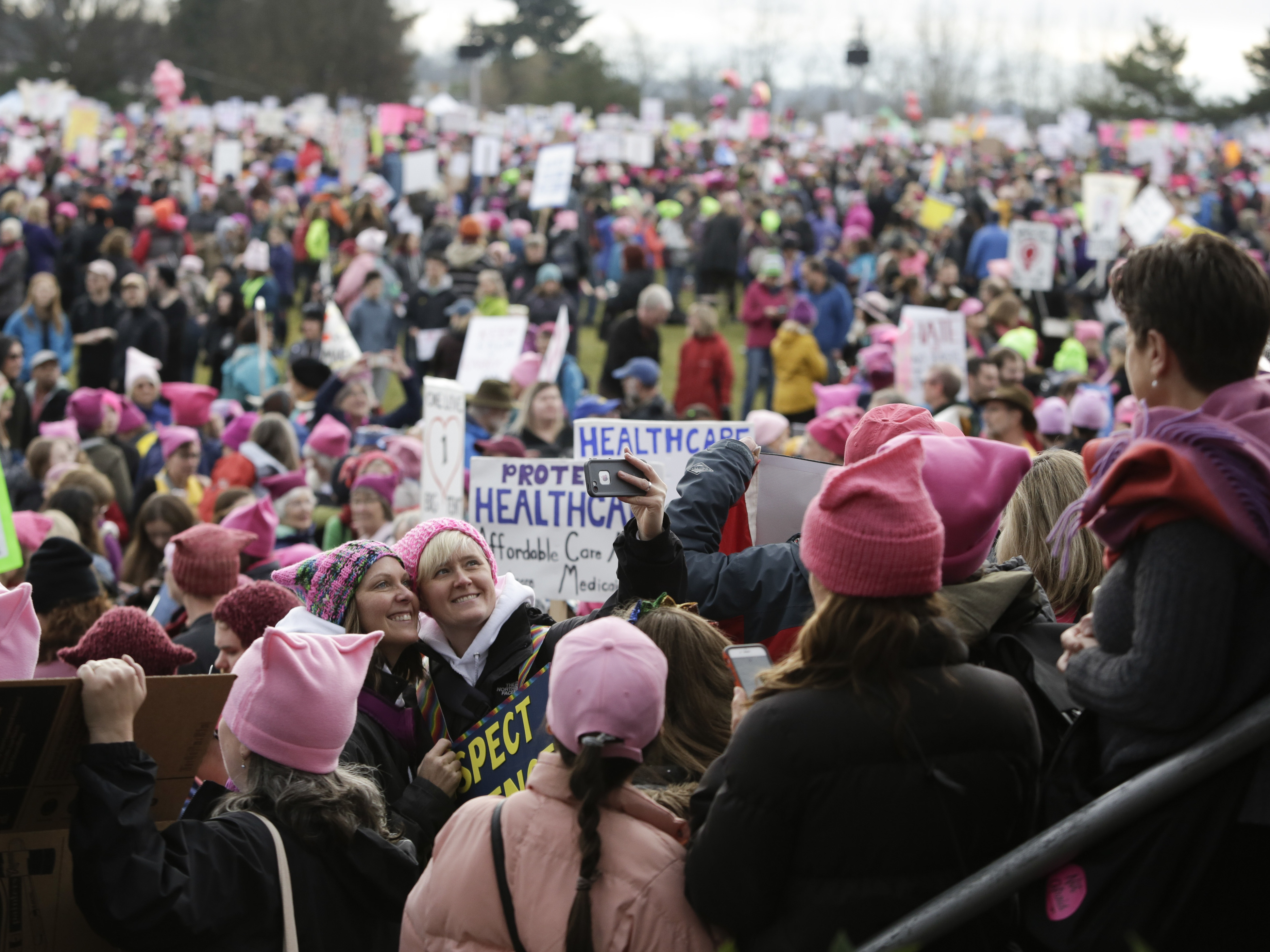 Led by women in pink &quot;pussy hats,&quot; hundreds of thousands of people packed the streets of Washington and other cities in a massive outpouring of opposition to America's new president, Donald Trump. (AFP/Getty Images)