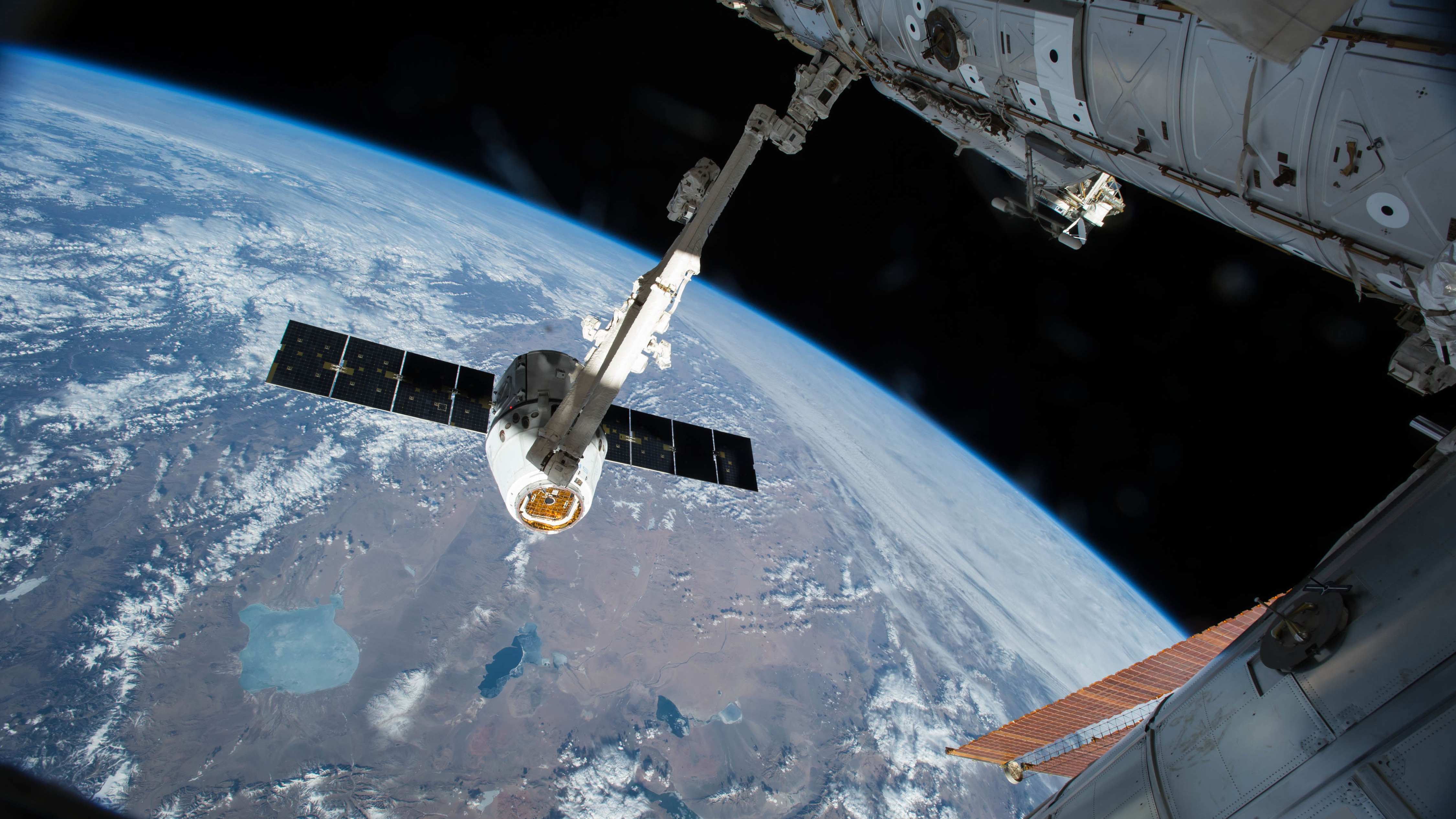 This is what failed to happen on Wednesday morning. In this image from April 17, 2015, a robotic arm on the International Space Station grasps a SpaceX Dragon cargo ship during docking.