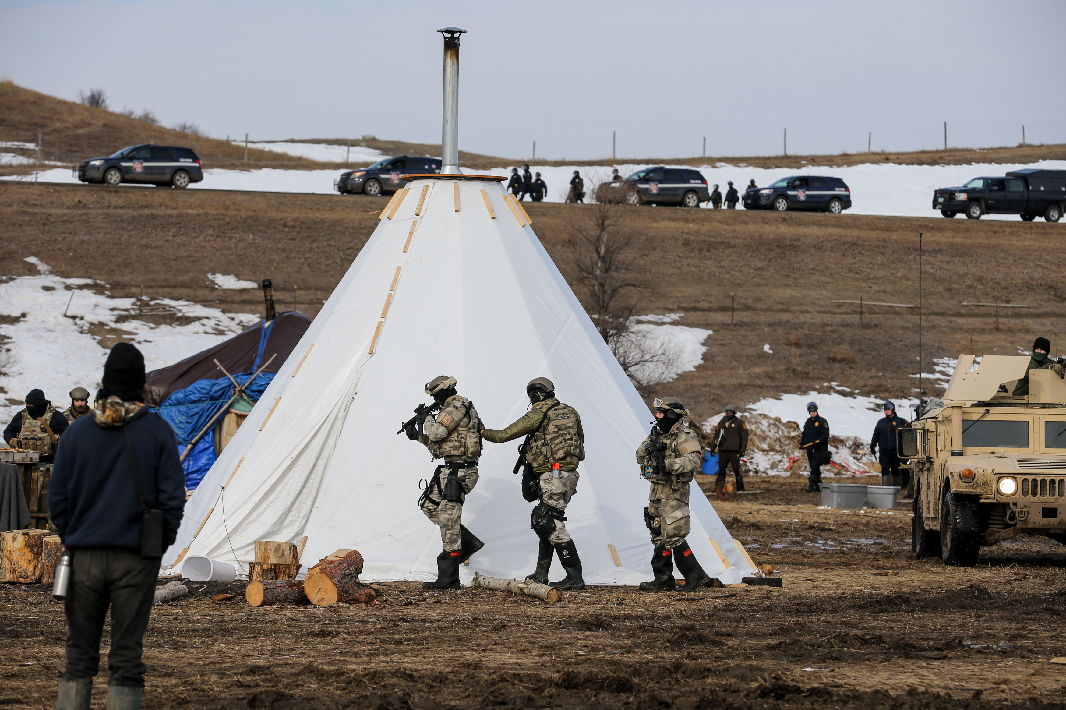 PHOTOS: The Final Hours Of A Dakota Access Pipeline Protest Camp 3 Police check tents one-by-one for remaining protestors.