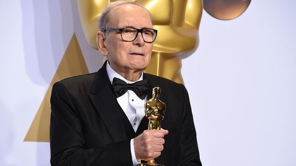 Composer Ennio Morricone, posing with his Oscar for The Hateful Eight in 2016. He died Monday at age 91 in Rome.