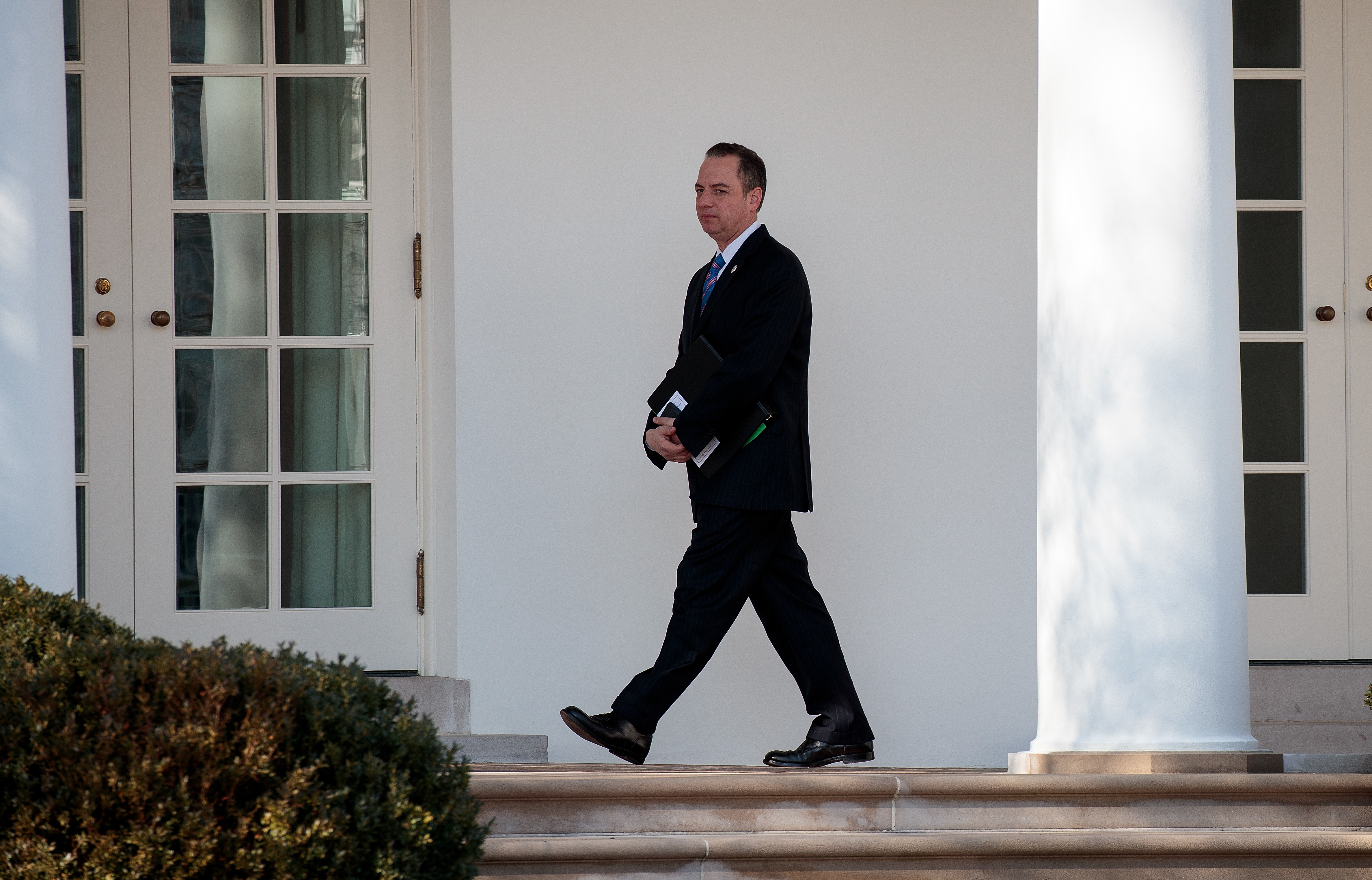 White House Chief of Staff Reince Priebus, seen here walking toward the Oval Office in January, had been in touch with the FBI over media reports about Trump associates and contacts with Russia, according to a senior administration official. (Getty Images)