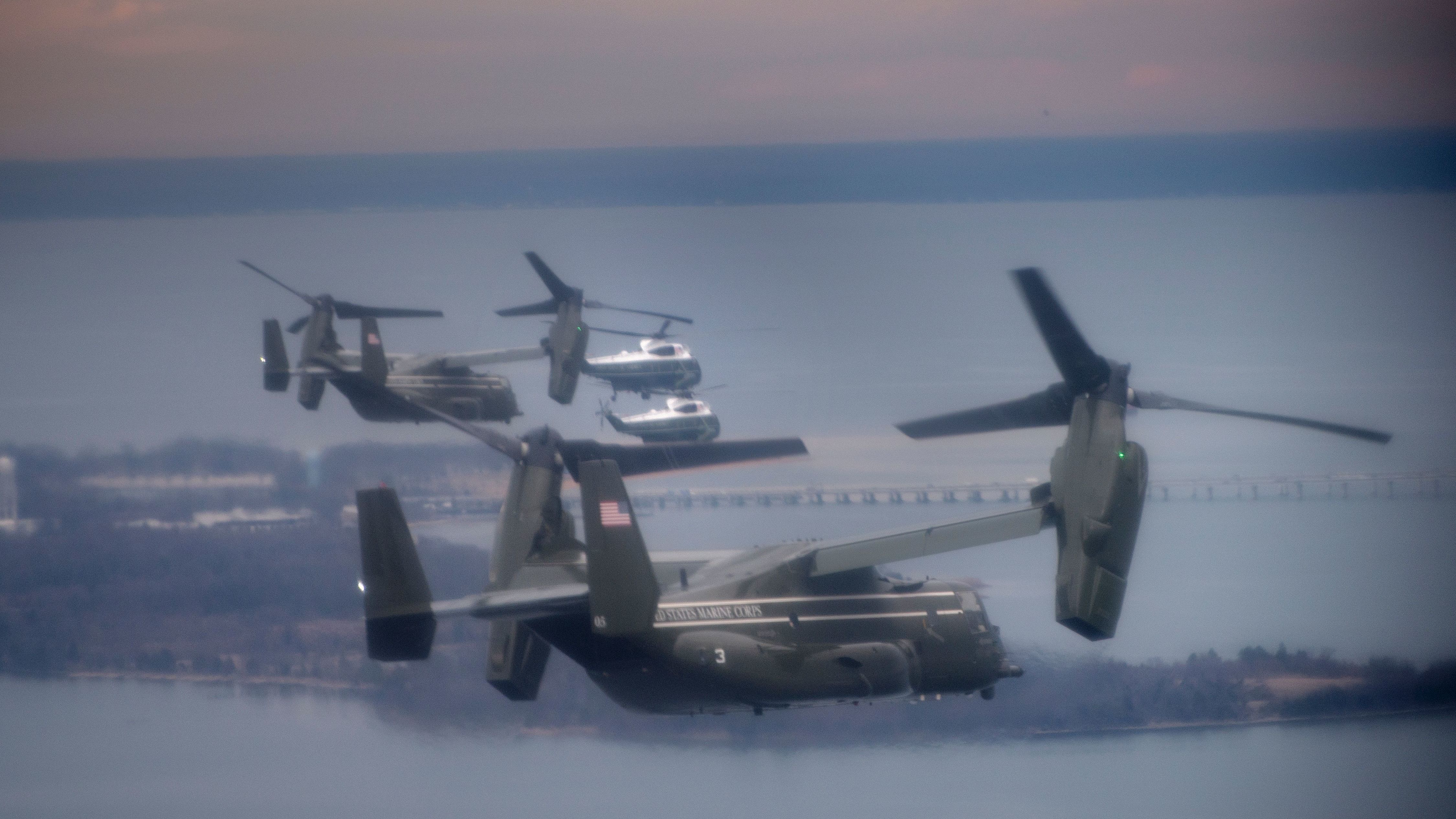 Marine One, with President Trump aboard, flies with a decoy and support helicopters to Dover Air Force Base for the dignified transfer of Navy SEAL Chief Petty Officer William &quot;Ryan&quot; Owens, who was killed in Yemen on Jan. 29. Owens' father says he refused to meet Trump. (AFP/Getty Images)