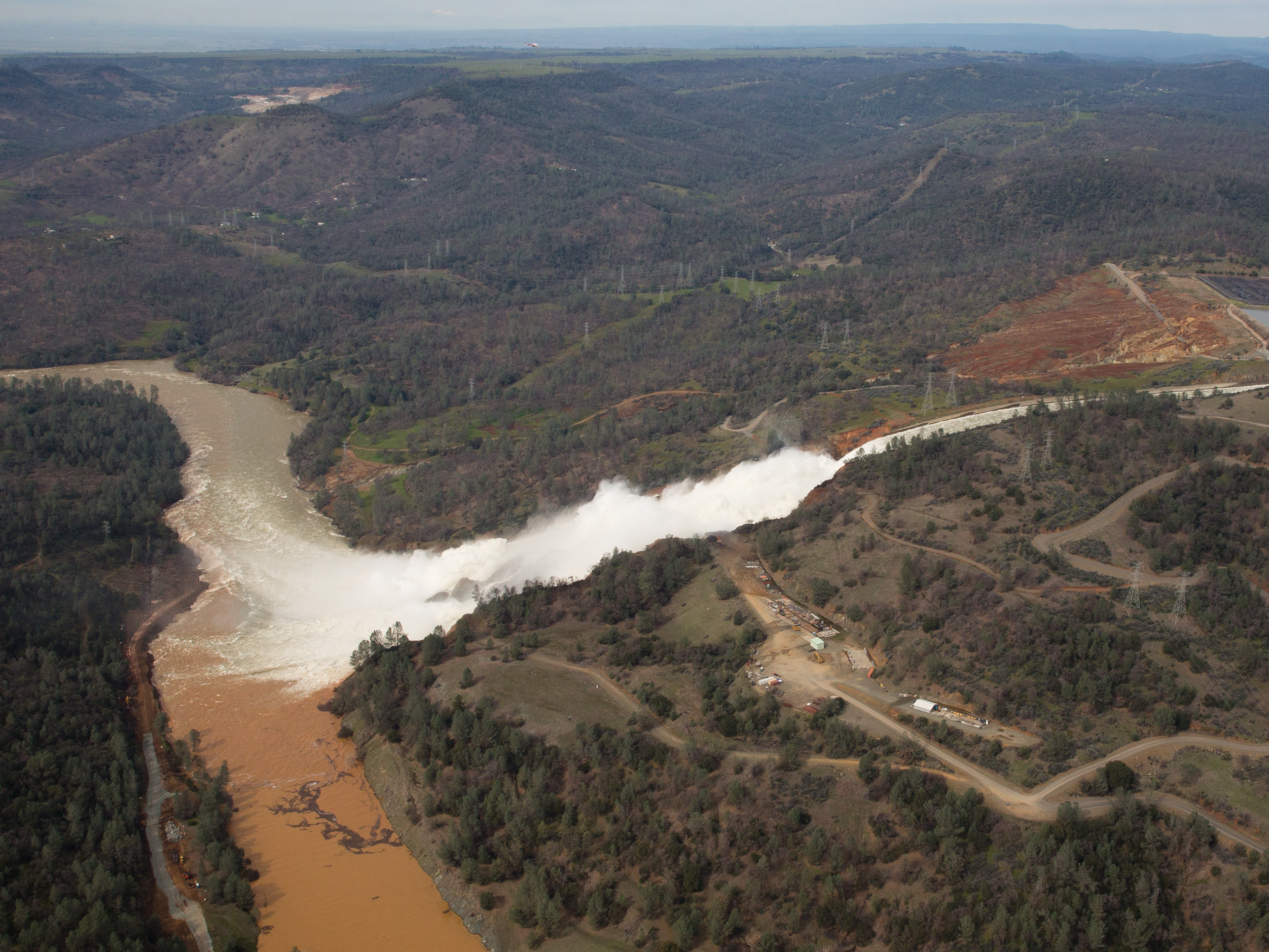 Almost 200,000 people were ordered to evacuate after a hole in the emergency spillway in Northern California's Oroville Dam threatened to flood the surrounding area. Climate change could be a factor of extreme flooding in California. (Getty Images)