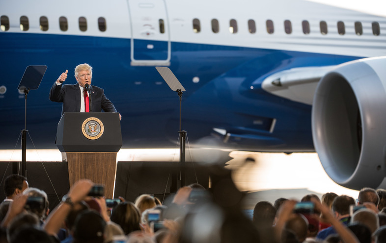 President Trump addresses a crowd during the debut of the new Dreamliner 787 at Boeing's South Carolina facilities on Feb. 17 in North Charleston. Trump uses Boeing as an example of his "America First" policies, but the plane parts come from all over. (Sean Rayford/Getty Images)