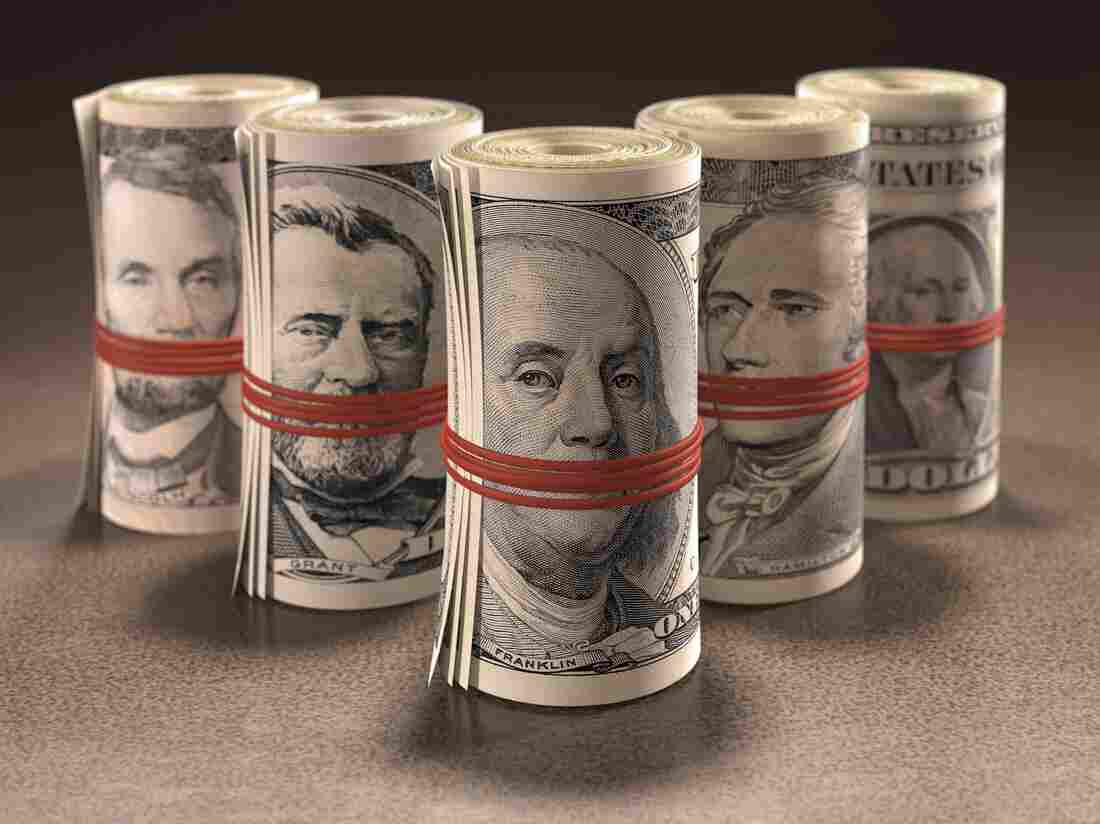 Money rolls, banded at mouth