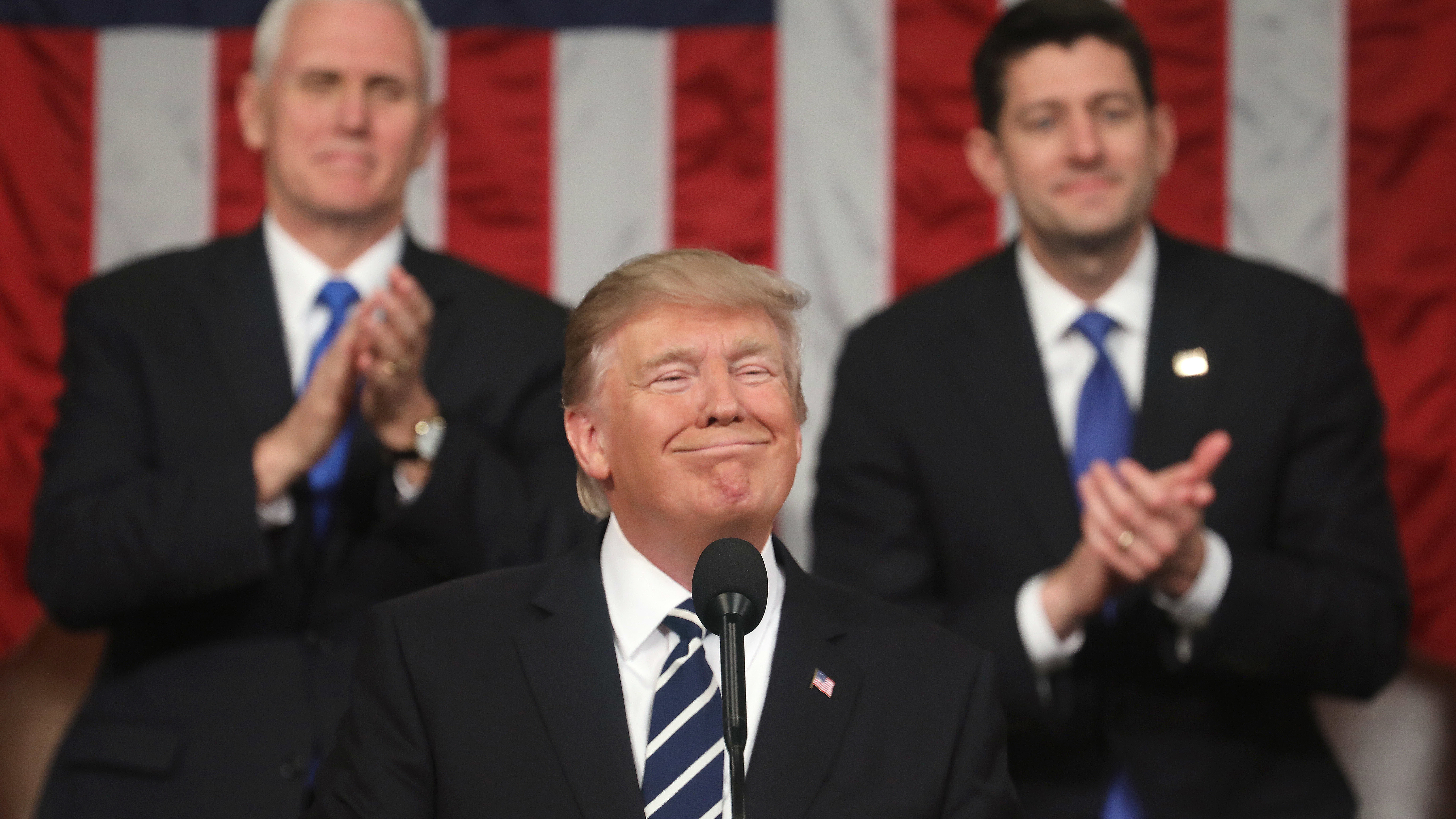 Vice President Pence and House Speaker Paul Ryan applaud as President Trump delivers his first address to a joint session of Congress Tuesday night. (Getty Images)