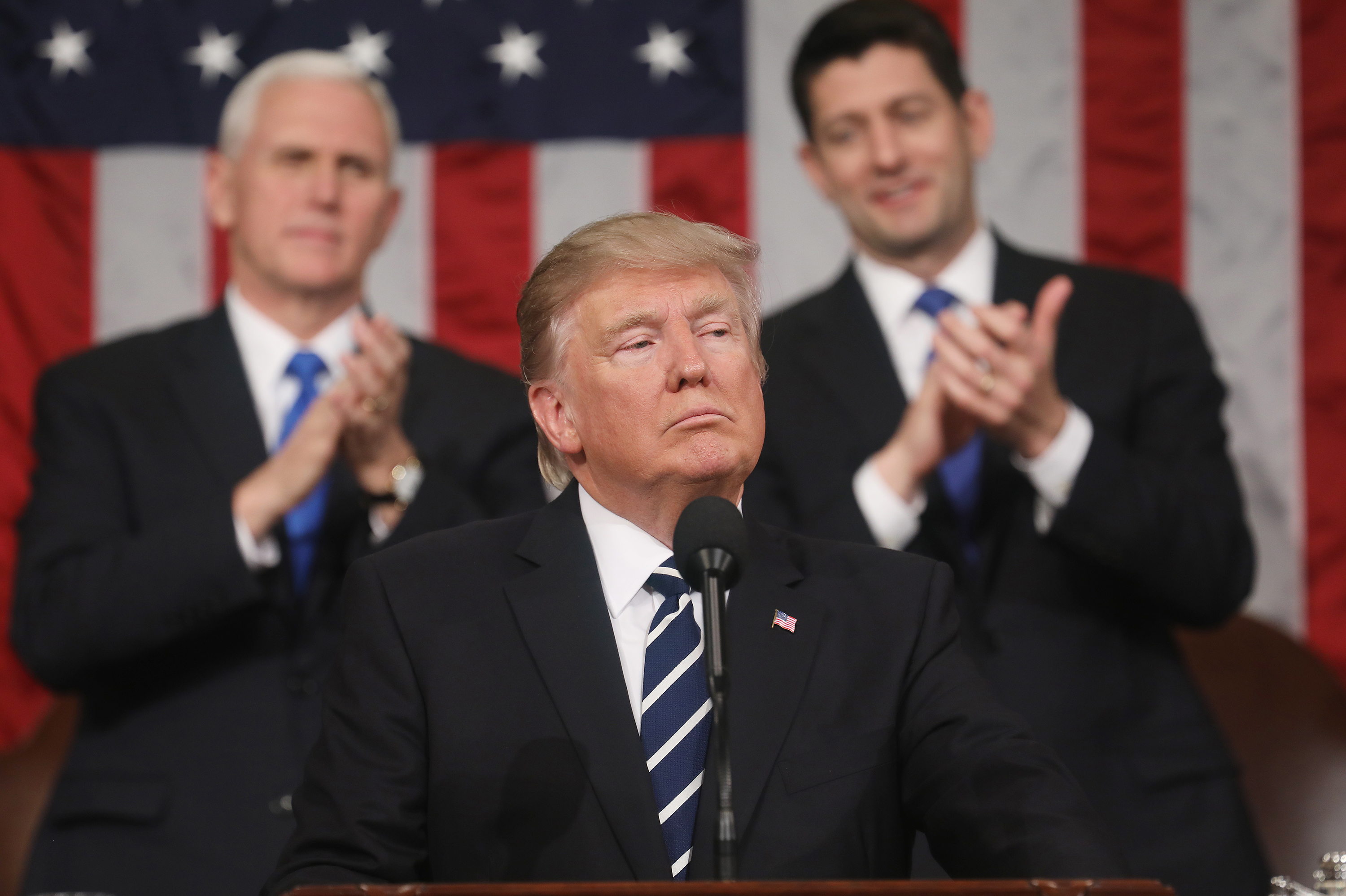 President Trump delivers his first address to a joint session of the Congress as Vice President Pence and Speaker Paul Ryan applaud on Tuesday. (Getty Images)