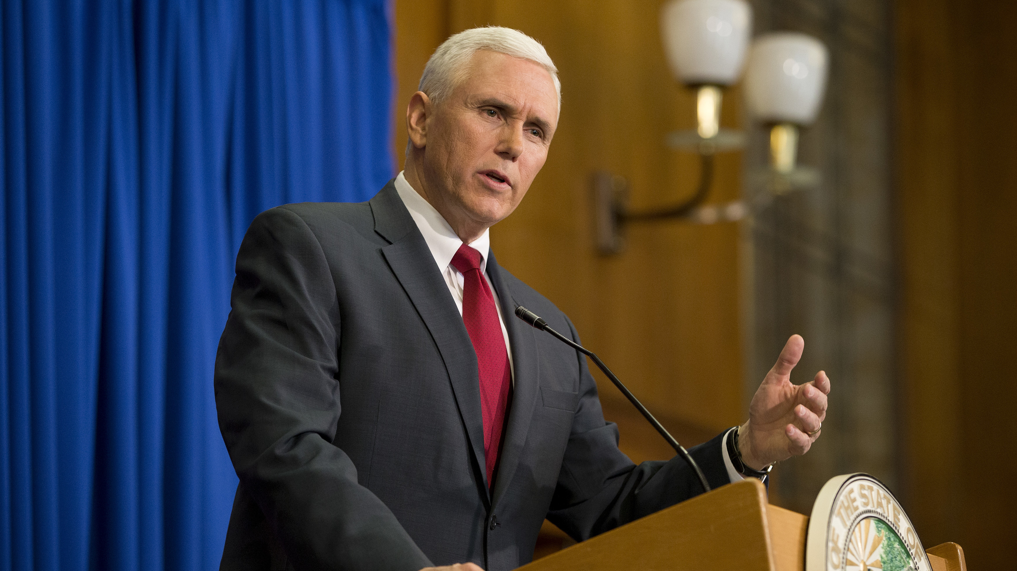 Then-Gov. Mike Pence of Indiana speaks at a press conference in 2015. Under Indiana law, public officials are allowed to use personal email accounts; the practice can help them avoid using official accounts to conduct political business. (Getty Images)