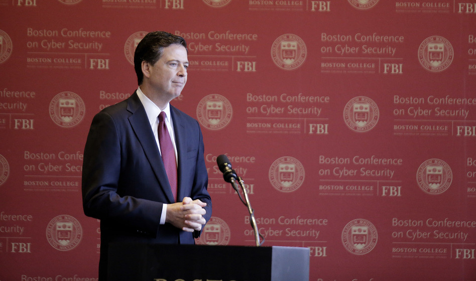 FBI Director James Comey attends the Boston Conference of Cyber Security at Boston College on Wednesday, where he said he has no plans to leave his post before the end of his term. (Stephan Savoia/AP)