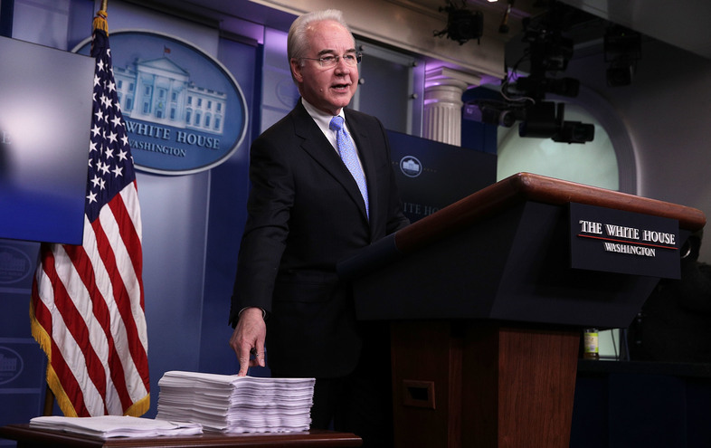 Health and Human Services Secretary Tom Price compares a copy of the Affordable Care Act (right) and a copy of the new House Republican health care bill during a White House press briefing on Tuesday. (Alex Wong/Getty Images)
