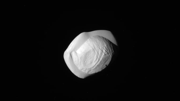 Images of Pan were taken by the NASA spacecraft Cassini on Tuesday.