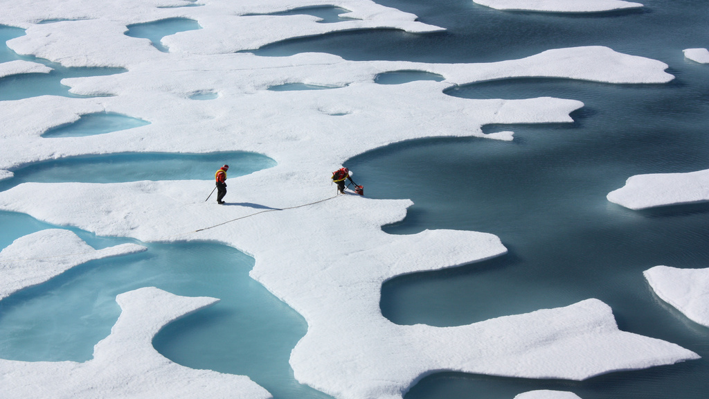 A U.S. Coast Guard crew retrieves a canister dropped by parachute in the Arctic in 2011. Over the past four decades, researchers at the University of California, Santa Barbara, and several other universities have studied shifts in atmospheric circulation above the Arctic.<strong></strong> (NASA/Kathryn Hansen)