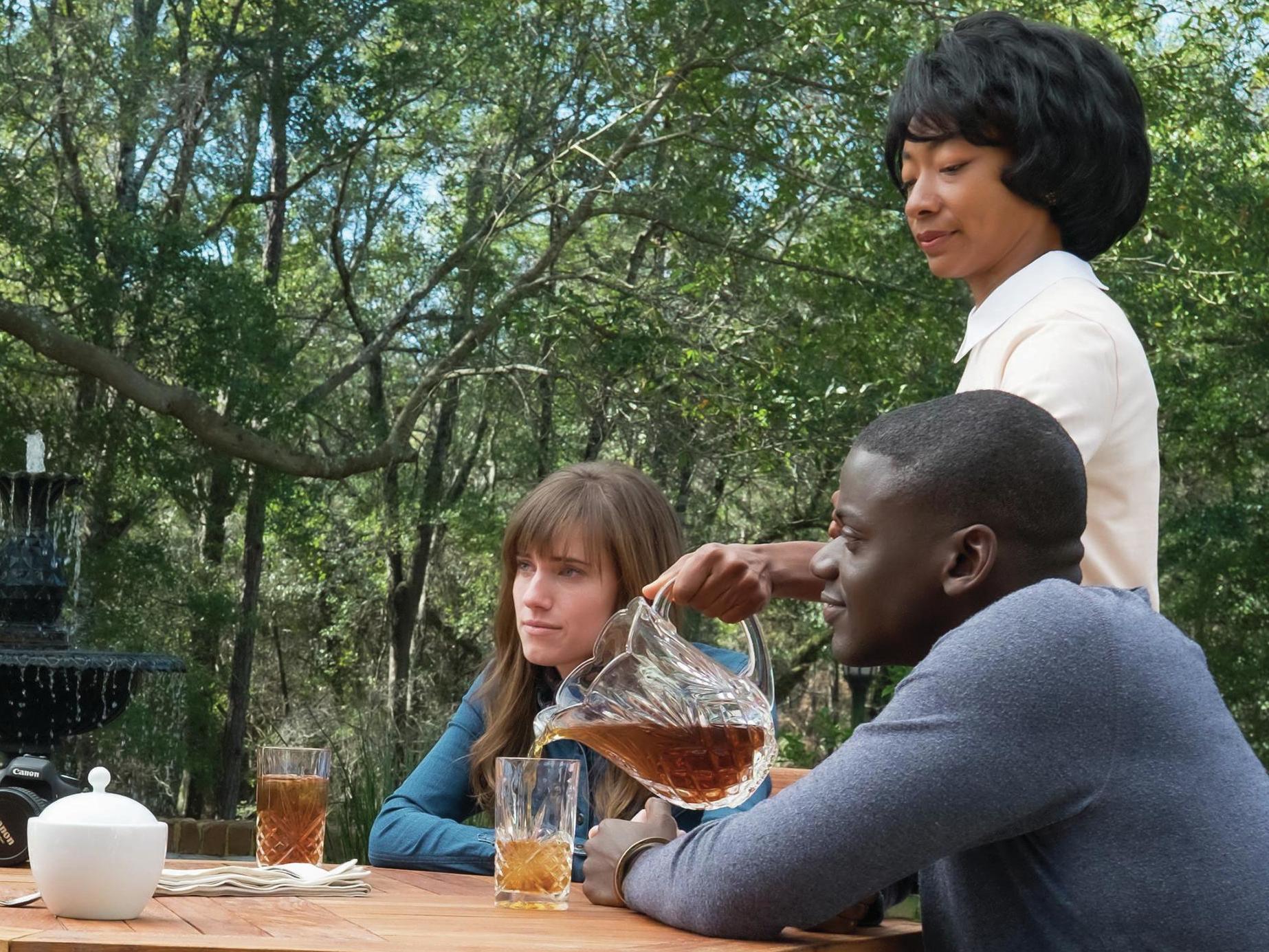 Chris sits down for tea with Rose's parents in 'Get Out.' (From left, Catherine Keener, Bradley Whitford, Allison Williams, Betty Gabriel and Daniel Kaluuya).
Justin Lubin/Universal Pictures