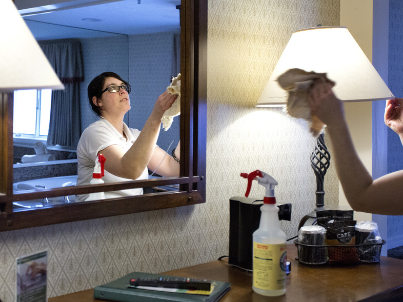 Trisha Lizotte, a room attendant at the Meadowmere Resort in Ogunquit, tidies a second floor room in March 2015. Establishments like the Meadowmere (pictured) and the Beachmere Inn hire many foreign workers in positions like Lizotte's over the course of the summer through the H-2B visa program. (Portland Press Herald/Press Herald via Getty Images)